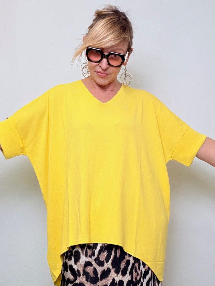 Maglia oversize con bottono dietro