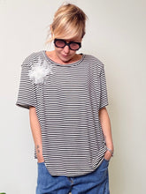 Maglia spallini con fiore