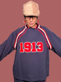 Felpa oversize con bande a contrasto e patch