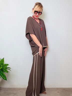 Pantalone palazzo con profili a contrasto