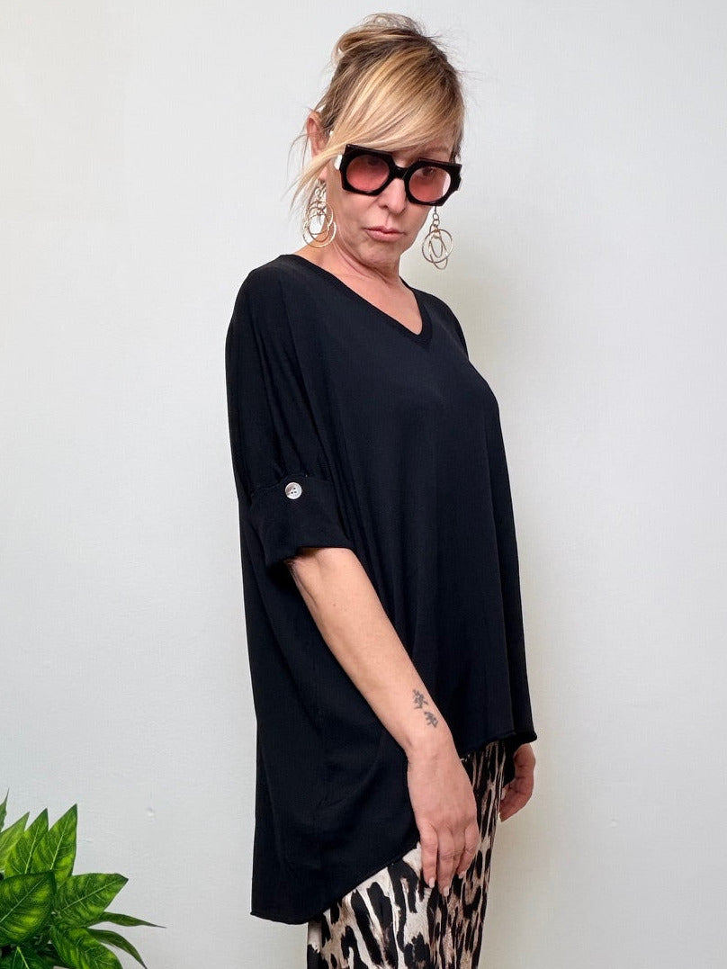 Maglia oversize  con bottono dietro