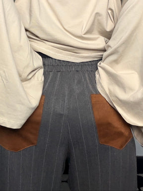 Pantalone gessato grigio con tasche a contrasto
