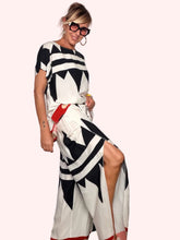 Pantalone fantasia geometrica bianco nero - vista laterale con spacco