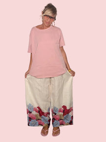 Pantalone palazzo lino latte con bordo floreale - vista intera gamba larga