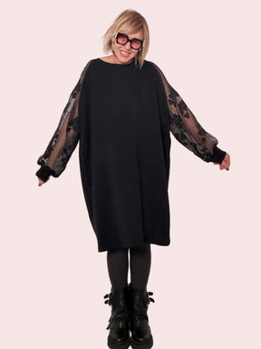 Abito morbido con mAbito morbido con maniche in rete florealeaniche in rete floreale