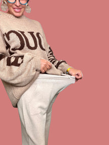 Pantalone palazzo beige da donna con linea morbida e fluida