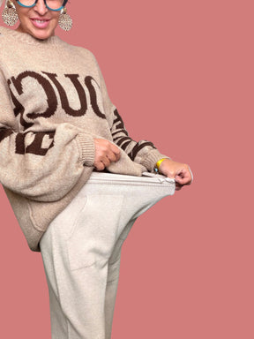 Pantalone palazzo beige da donna con linea morbida e fluida