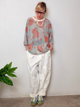 Jeans over con strappi e inserti in rete